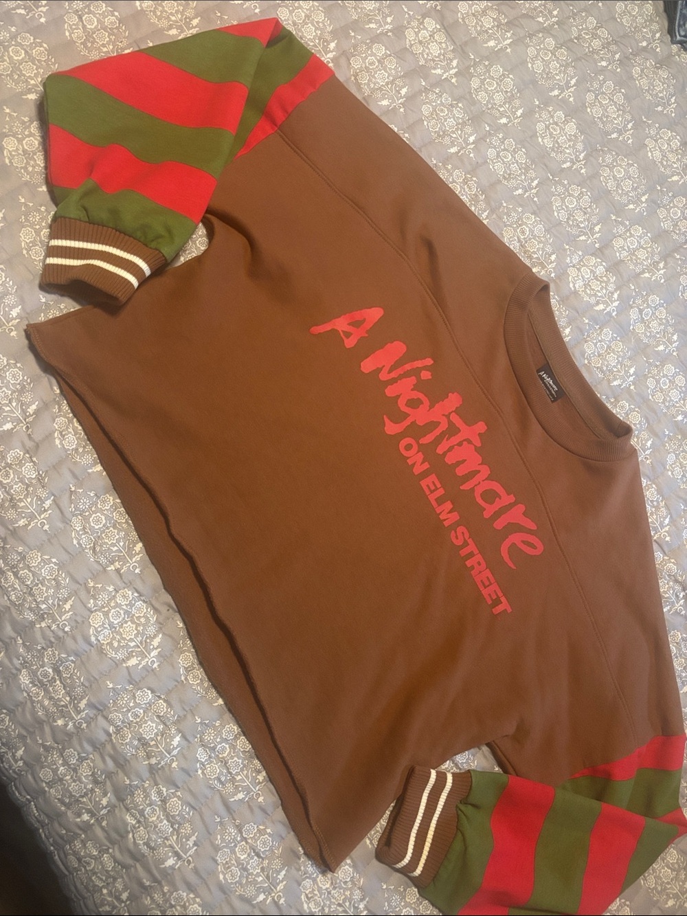 Spirit Halloween Cropped Freddy Crewneck Sweater with Striped Sleeves